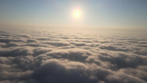 Airplane flight. Flying above the clouds. View from the window of the plane. Traveling by air