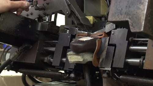 Shoe Being Worked on in Factory Machine