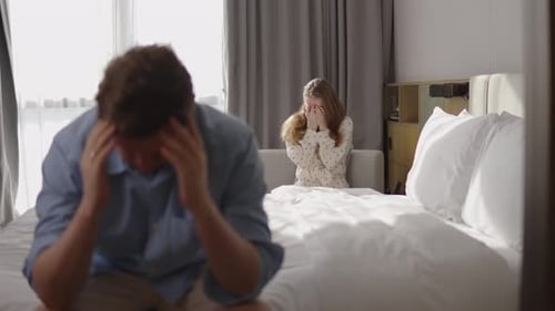 Angry Man Confronting His Girlfriend After Discovering Betrayal Arguing Emotionally in Bedroom