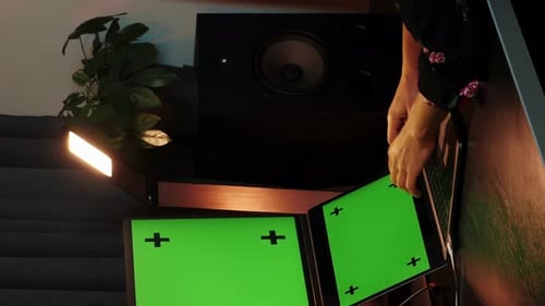 Woman working on computer, using computer wireless mouse. Green mockup. Vertical video