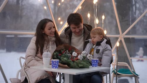 Loving Family Together in Winter Dome