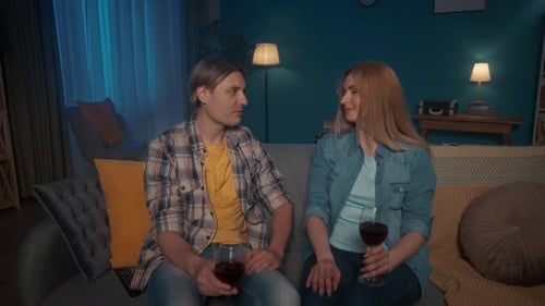 Romantic Couple Enjoying Wine Together at Home