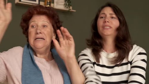 Two Women Talking Indoors