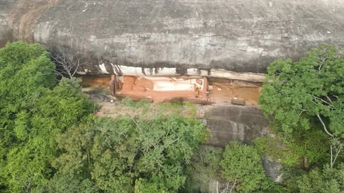 Stunning Shot Of Sigiriya Pidurangala Buddha Statue Under Huge Rock In Nature, Sri Lanka