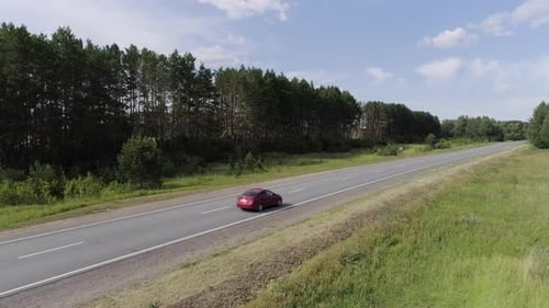 Top View of Passing Car on Highway in Forest Scene Beautiful View of Country Road with Forest on
