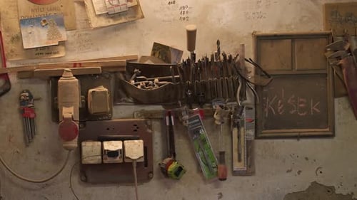 tools on the wall in an old workshop