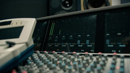 A large mixing console in a recording studio close-up of an equalizer multi-channel sound recording