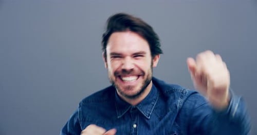 Man Dancing and Smiling with Joyful Expression