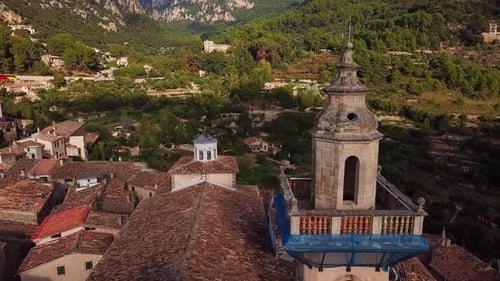 Aerial view of Valldemossa curch and cityscape, Mallorca, Spain, surrounded by mountains