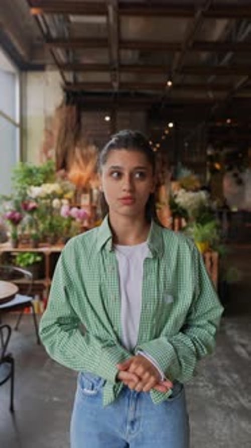 A Female Florist Working in a Flower Shop Talks About Her Job