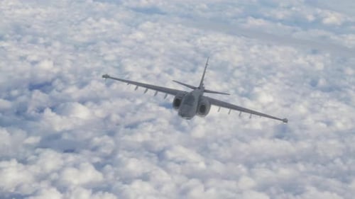 Modern Military Jet Flying Through Cloudy Sky