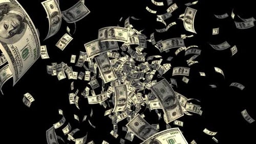 Explosion of dollar bills on black background
