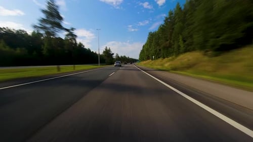 Timelapse from inside a car travelling through rural road then onto a highway