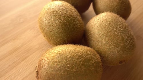 Close-Up of Kiwi Fruit on Wooden Surface