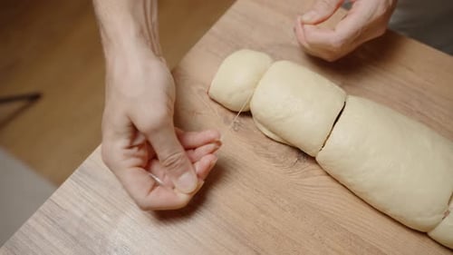 Cutting Dough Log Into Rolls With Thread