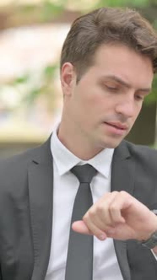 Waiting Businessman Checking Time on Wrist Watch Outdoor, Vertical Video