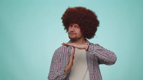 Young Adult Gestures Time Out Hand Signal