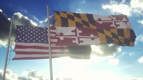 United States and Maryland State Flags Waving Against Blue Sky