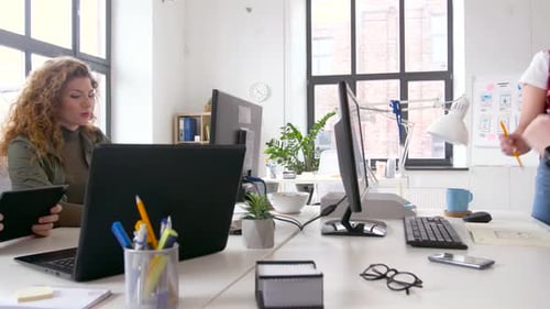 Creative Team or Designers with Computers Working on User Interface at Office Adult
