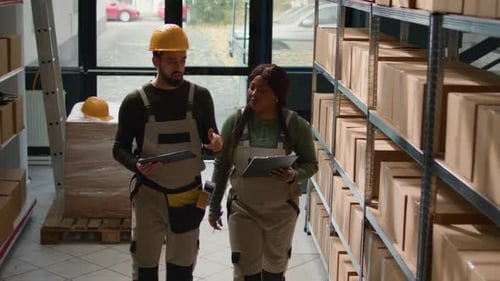 Employees Review Warehouse Inventory
