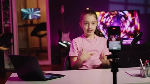 Teen Girl Recording Video at Desk with Microphone