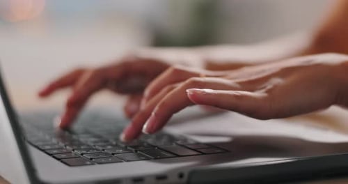 Fingers Typing on Laptop Keyboard in Close Up
