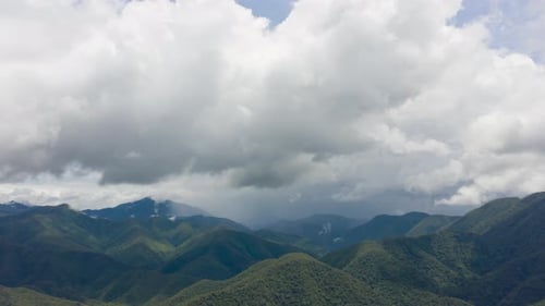 4K Time lapse of mountains on rainy day and clouds moving along the rain, stormy cloud, rainy season