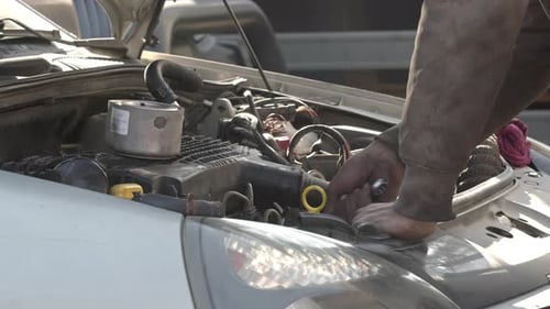 Repair Of A Malfunctioning Car Engine With A Double Blade Wrench