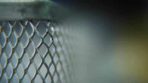 Close-up of Gray Metal Mesh Container