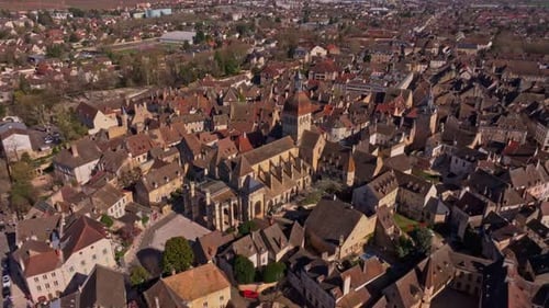 Early spring light shining over rooftops in Beaune France