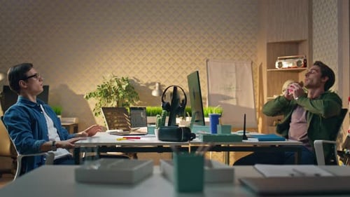 Relaxed Colleagues Tossing Ball Playing Office Two Startupers Resting Together