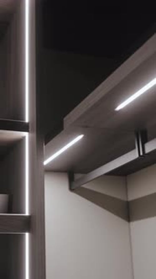 Modern Closet Interior with Sliding Doors and LED Lighting