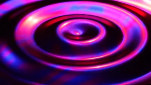 Lebendiger, wirbelnder Wirbel aus rosafarbenem und blauem Licht fängt dynamische Energie ein