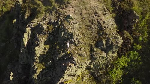 Aerial View of Climber Solo Free Climbing on Cliffs Alone Man Climb the Rock Without Safety Harness
