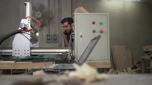 Carpenter is working at workshop.