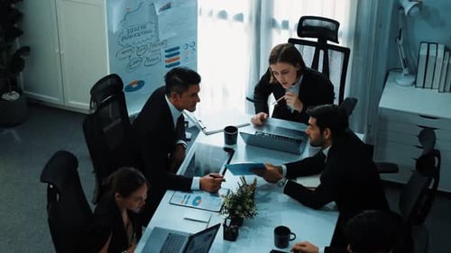 Top view of female leader looking financial statistic at meeting. Directorate.