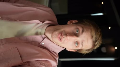 Smiling Man Giving Peace Sign in Portrait View
