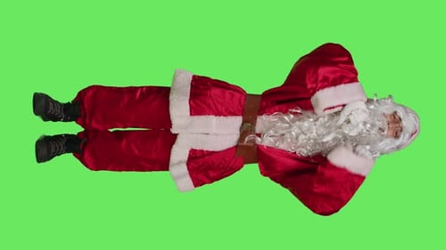 Man in Santa Suit Pointing on Green Screen