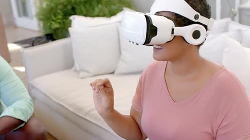 Woman Using Virtual Reality Headset Indoors