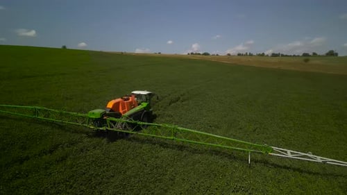 Spray Fertilize On Field With Chemicals In Agriculture Field