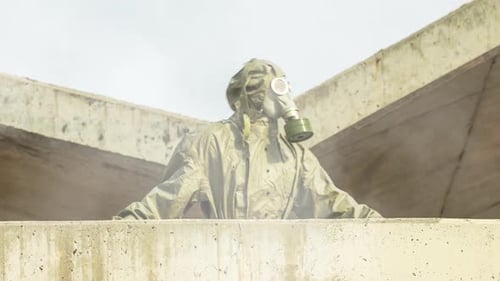 Man Wearing Gasmask and Suit Outdoors