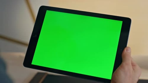 Hands Using Tablet with Green Screen for Compositing