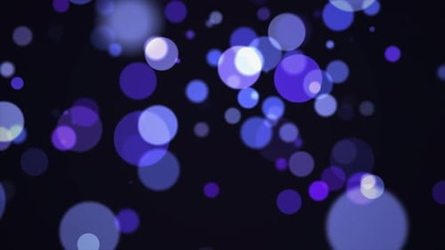 Abstract Floating Blue and Purple Bokeh Light Particles