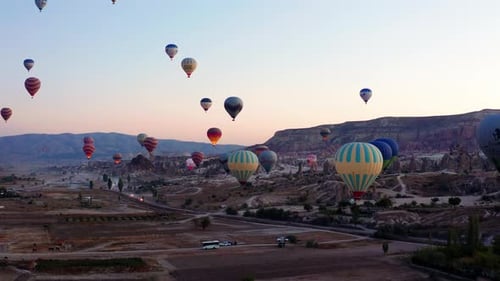 Hot Air Balloons Drifting over Cappadocia at Sunrise