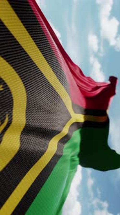 Realistic Vanuatu Flag Waving Against a Cloudy Blue Sky