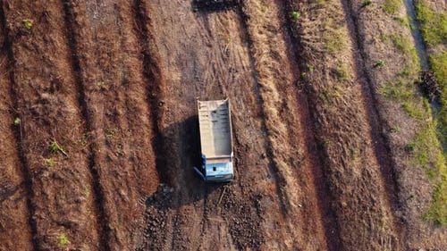 Aerial view of heavy earthmovers in construction site.