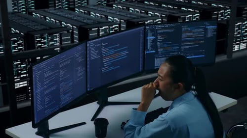 Tired Asian Woman Developer Yawning Before Sleeping While Write Code In Data Center