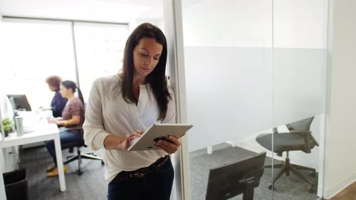 Businesswoman Using Digital Tablet in Office Doorway 4044 Years