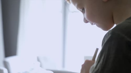Child Helping Adult Mix Ingredients in Bowl