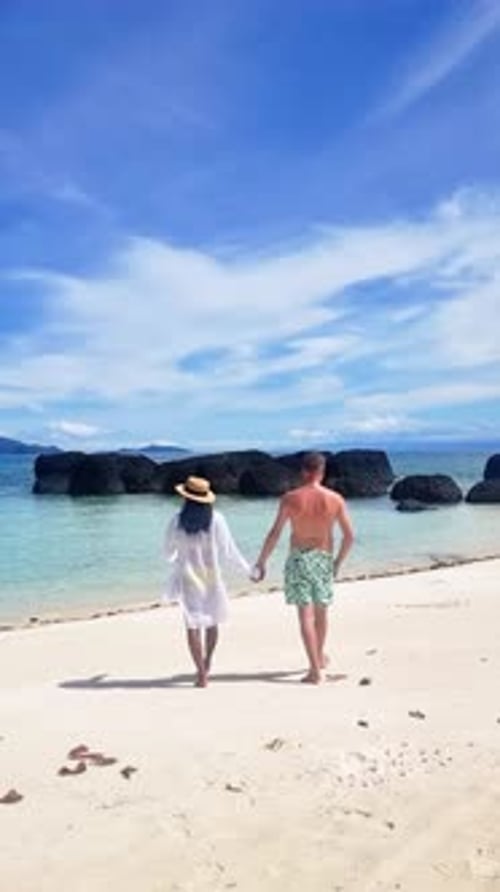 A Couple Strolls on the Beach Hand in Hand Under a Sunny Sky Koh Mak Thailand Koh Kham
